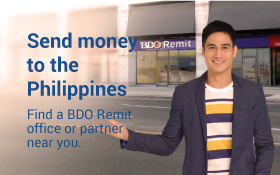 A professional man outside of BDO Remittance